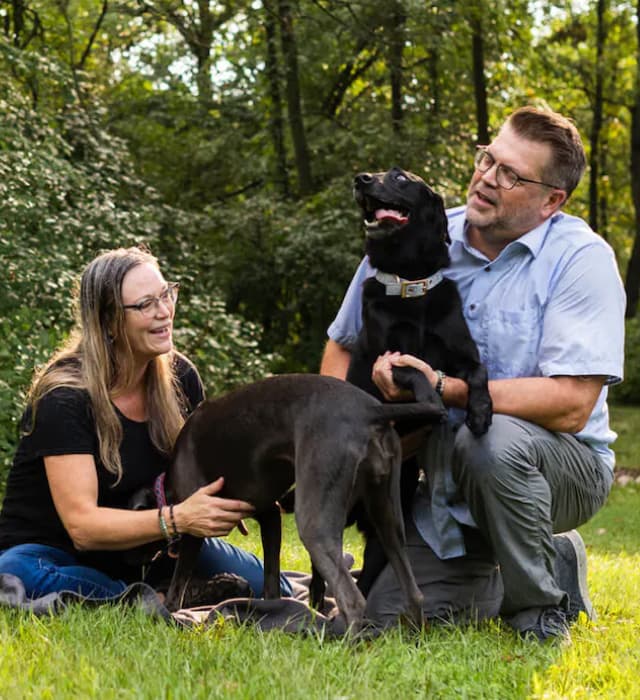 Man and woman with two dogs